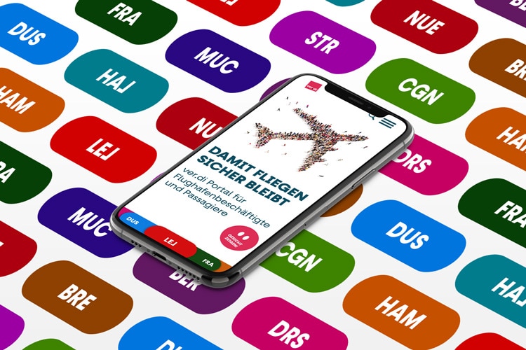 Smartphone mit abgebildeter Startseite des verdi Portals auf Hintergrund mit bunten Buttons mit Flughafenkürzeln in weißer Schrift