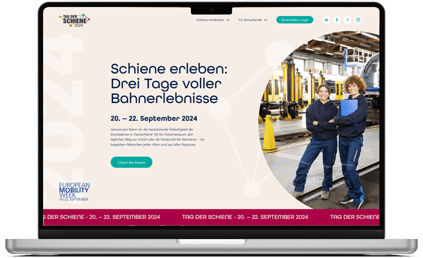 Laptop mit der Website &bdquo;Tag der Schiene 2024&ldquo;. Das Bild zeigt die Event-Ank&uuml;ndigung (20.&ndash;22. September) und zwei Mitarbeiterinnen in einer Bahn-Werkshalle.